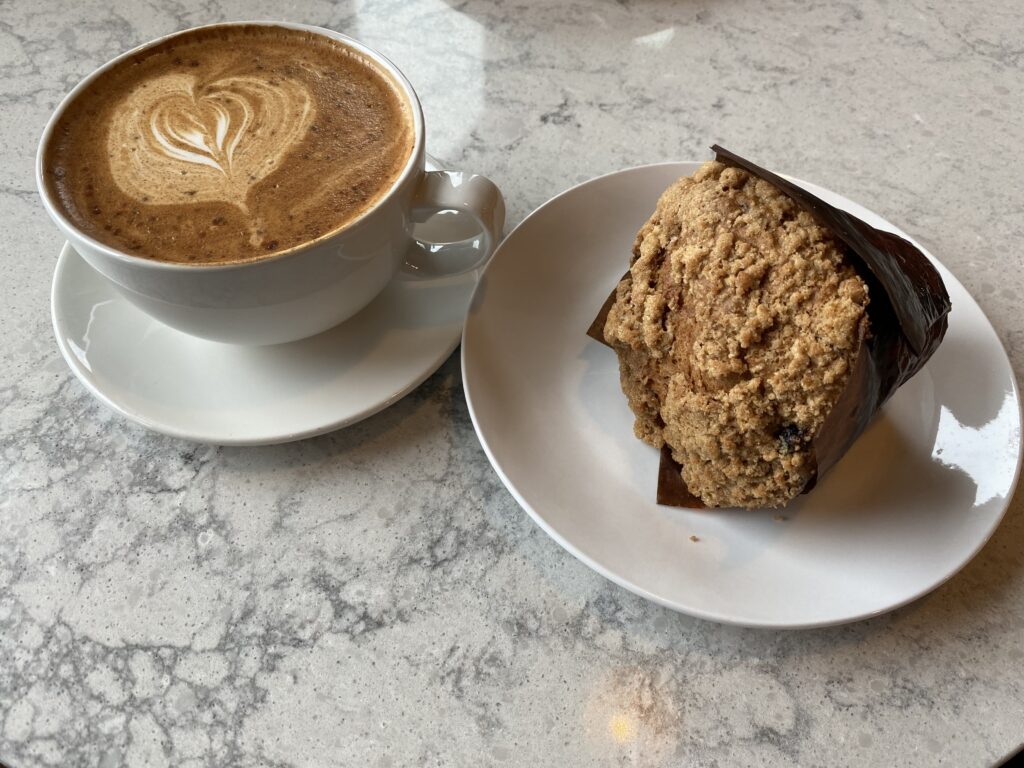 Coffee and gluten free muffin at Caffe Delish in Port Coquitlam, BC