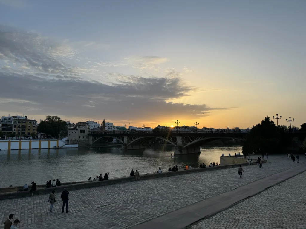 Sunset towards Triana neighbourhood in Seville, Spain